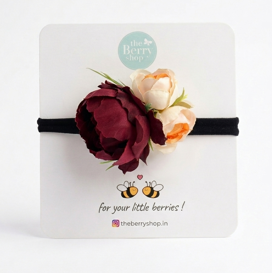 Burgundy and cream floral baby headband with soft elastic band for baby girls.