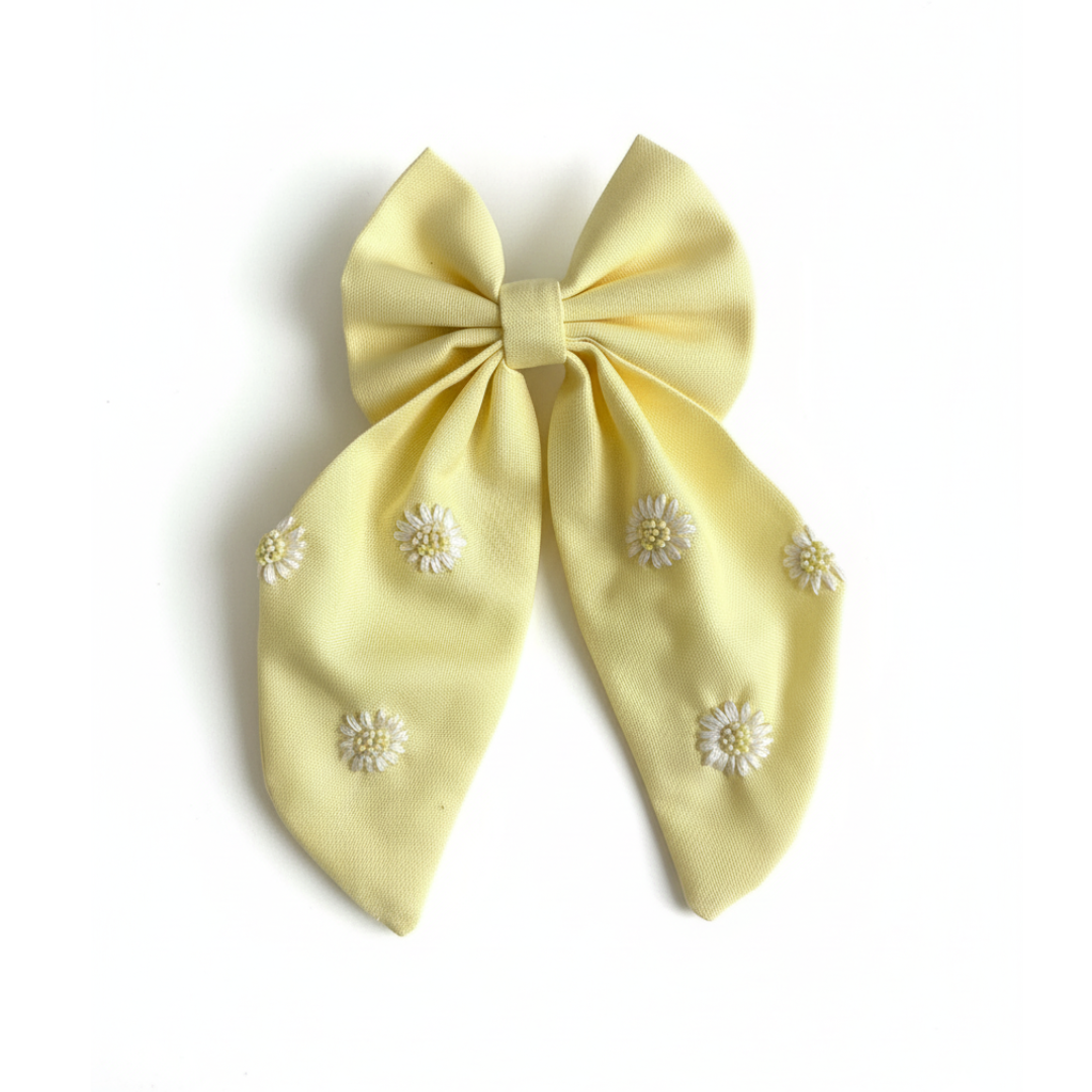 yellow daisy hair bow, embroidered hair clip for girls, handmade long tail bow, floral baby hair accessory, pastel yellow hair bow, cute summer bow for kids, embroidered daisy bow clip, boutique baby bow